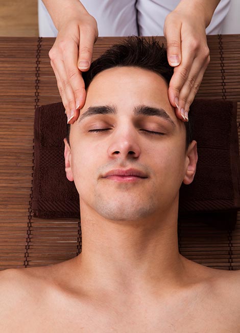 man receiving head massage